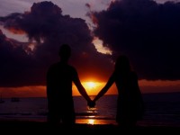 Romantic vacation, couple watching sunset