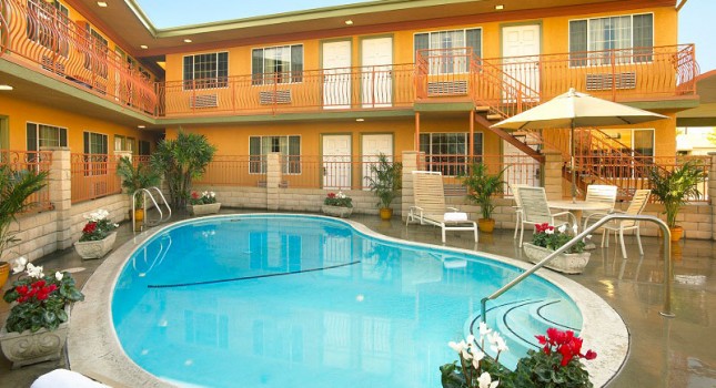 Pool and backyard at Studio Inn and Suites